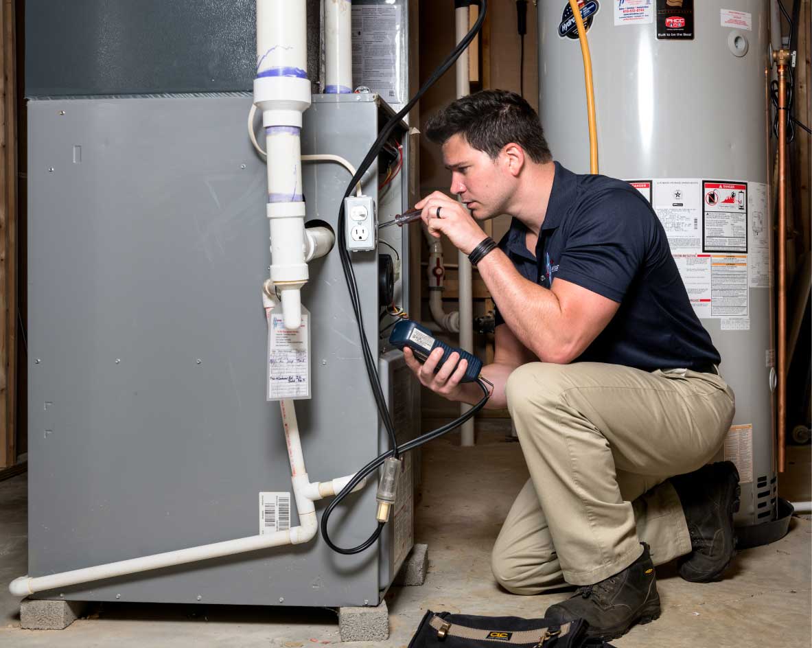 HVAC technician performing a furnace tune-up in Windsor